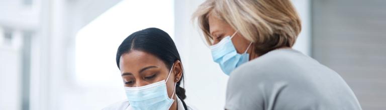 doctor and patient wearing masks